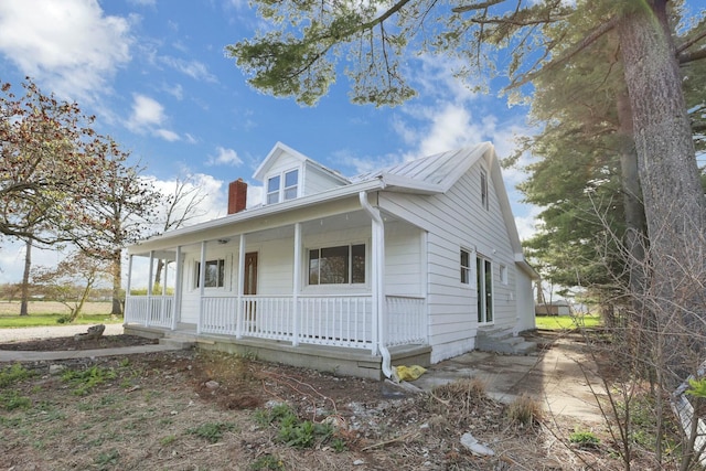 3907 Condit Rd, Sunbury, OH 43074 - view of front of house with a chimney and covered porch