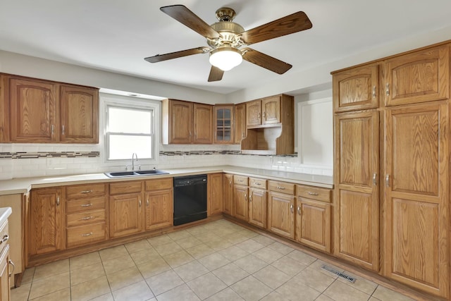 3907 Condit Rd, Sunbury, OH 43074 - kitchen featuring tasteful backsplash, a sink, brown cabinets, dishwasher, and visible vents