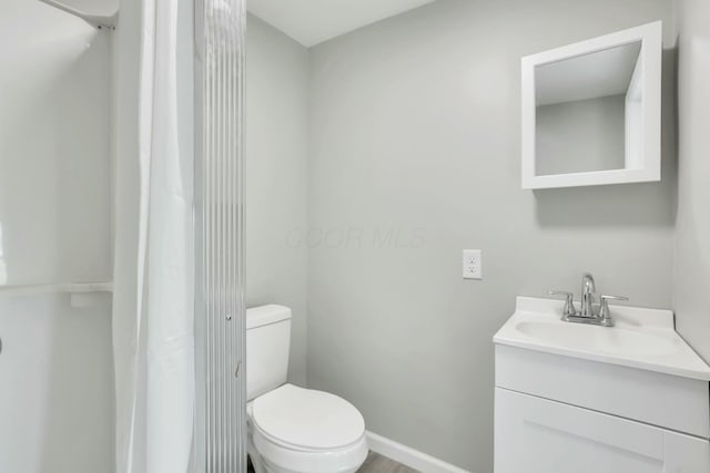 3907 Condit Rd, Sunbury, OH 43074 - bathroom with baseboards, toilet, and vanity