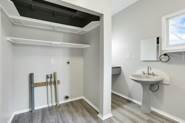 3907 Condit Rd, Sunbury, OH 43074 - laundry room featuring washer hookup, wood finished floors, baseboards, and electric dryer hookup