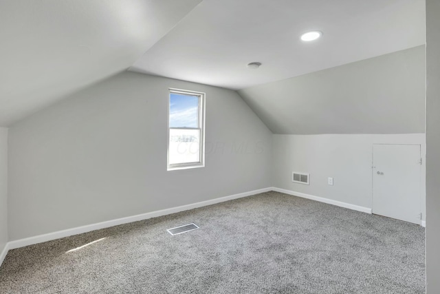 3907 Condit Rd, Sunbury, OH 43074 - additional living space with carpet, visible vents, lofted ceiling, and baseboards