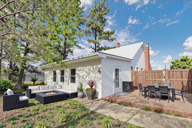 3907 Condit Rd, Sunbury, OH 43074 - back of house featuring a patio area, an outdoor living space with a fire pit, and a fenced backyard