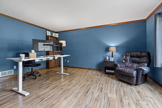 home office featuring crown molding, wood finished floors, a textured ceiling, and baseboards