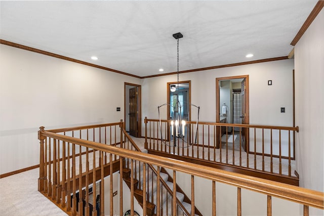 stairway featuring recessed lighting, carpet floors, baseboards, ornamental molding, and a chandelier