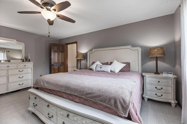 bedroom with light colored carpet and ceiling fan