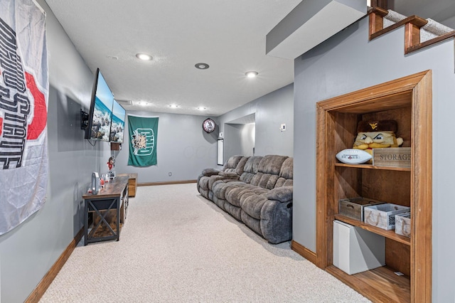 carpeted living area with baseboards and recessed lighting
