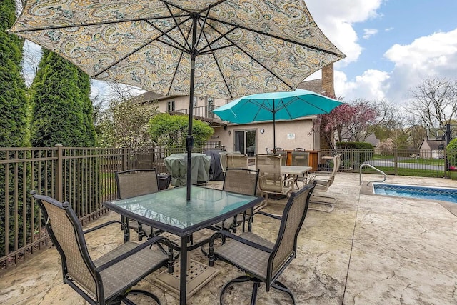 view of patio / terrace with outdoor dining area and fence