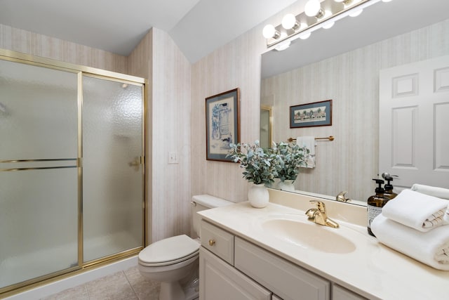 bathroom featuring a shower stall, wallpapered walls, and toilet