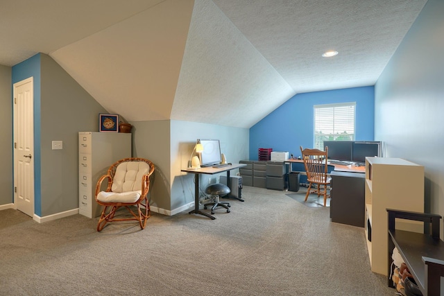 home office with a textured ceiling, baseboards, carpet, and lofted ceiling