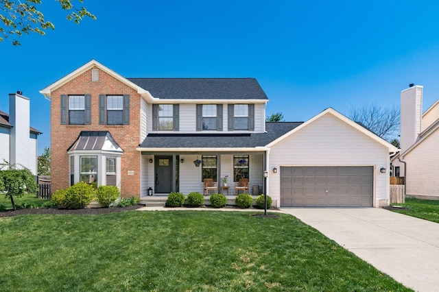 traditional home with concrete driveway, covered porch, a front yard, a garage, and roof with shingles