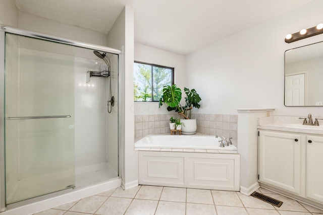 full bath with a garden tub, visible vents, tile patterned floors, and a stall shower