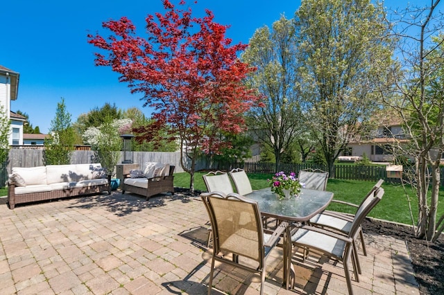 view of patio / terrace with a fenced backyard, outdoor lounge area, and outdoor dining area
