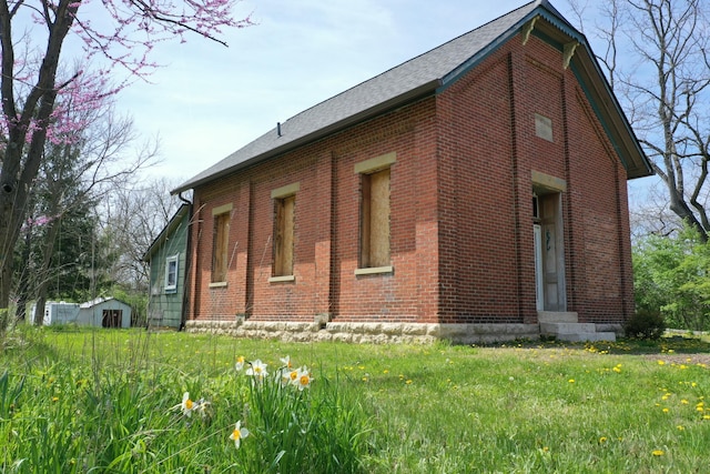 2263 Amity Rd, Hilliard, OH 43026 - view of side of property with an outdoor structure and brick siding