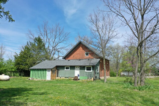 2263 Amity Rd, Hilliard, OH 43026 - rear view of house with a lawn and roof with shingles