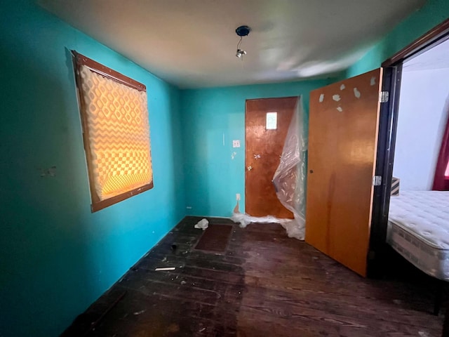 spare room with wood finished floors