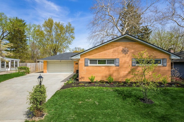 144 Serran Dr, Gahanna, OH 43230 - single story home featuring driveway, an attached garage, fence, a front yard, and brick siding