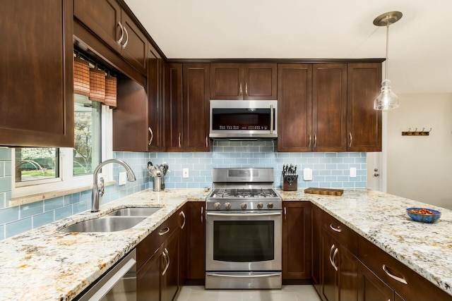 144 Serran Dr, Gahanna, OH 43230 - kitchen with appliances with stainless steel finishes, tasteful backsplash, and a sink