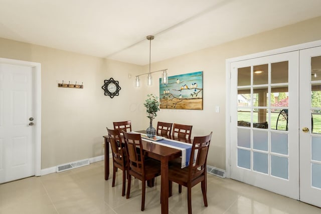 144 Serran Dr, Gahanna, OH 43230 - dining room featuring visible vents, baseboards, french doors, and light tile patterned floors