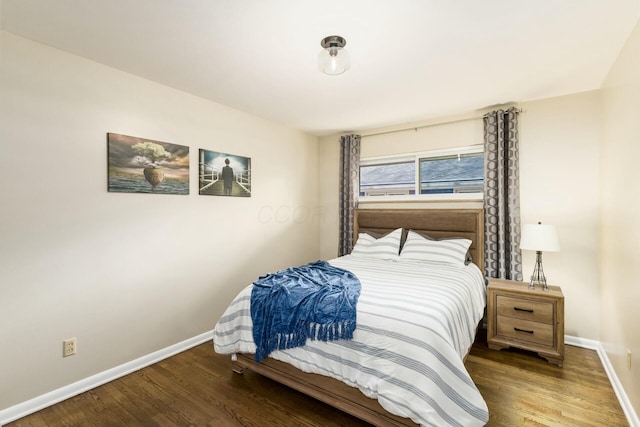 144 Serran Dr, Gahanna, OH 43230 - bedroom featuring baseboards and wood finished floors