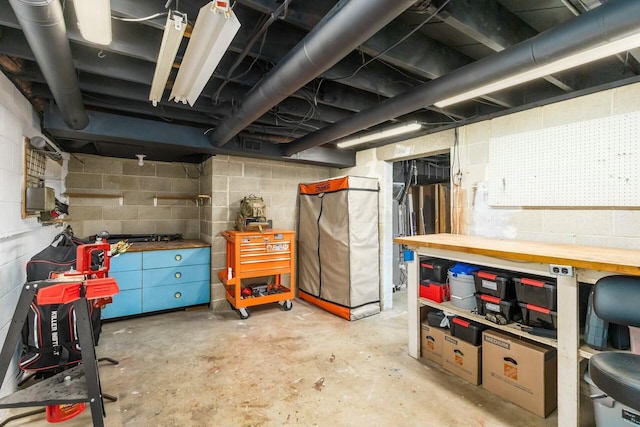 144 Serran Dr, Gahanna, OH 43230 - unfinished below grade area featuring concrete block wall and a workshop area
