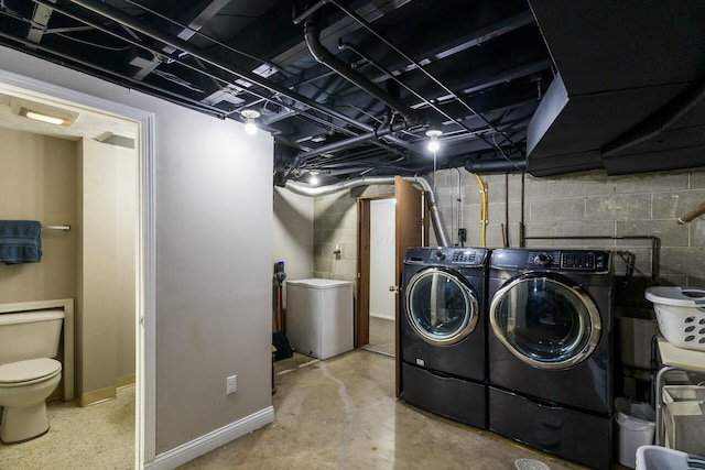 144 Serran Dr, Gahanna, OH 43230 - clothes washing area with washing machine and dryer, baseboards, and laundry area