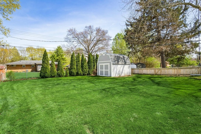 144 Serran Dr, Gahanna, OH 43230 - view of yard featuring a fenced backyard, a storage unit, and an outdoor structure