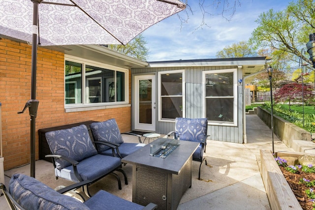 144 Serran Dr, Gahanna, OH 43230 - view of patio featuring an outdoor fire pit