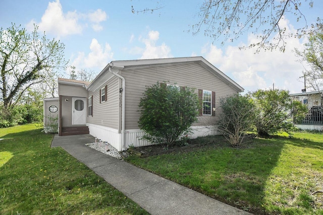 230 Norman Ln, Reynoldsburg, OH 43068 - view of home's exterior with a yard