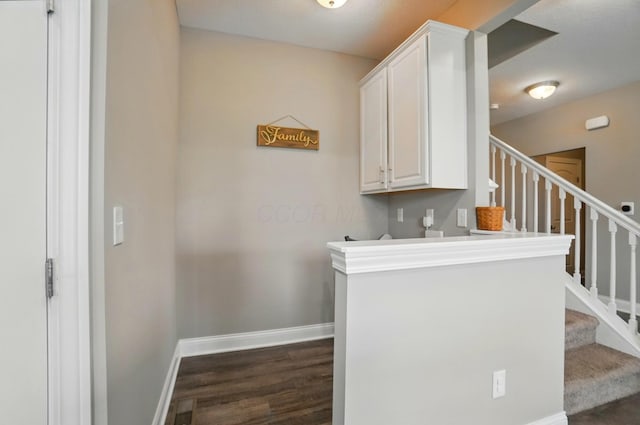 interior space with visible vents, wood finished floors, and baseboards