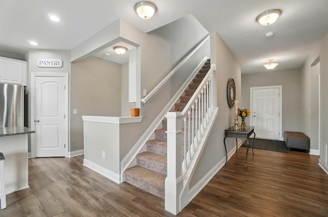 interior space featuring wood finished floors, recessed lighting, and baseboards