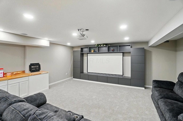 home theater room featuring carpet, recessed lighting, and baseboards