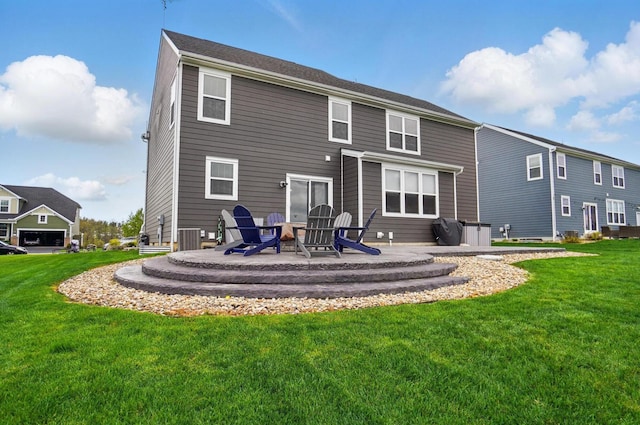 back of house featuring cooling unit, a lawn, a fire pit, and a patio area