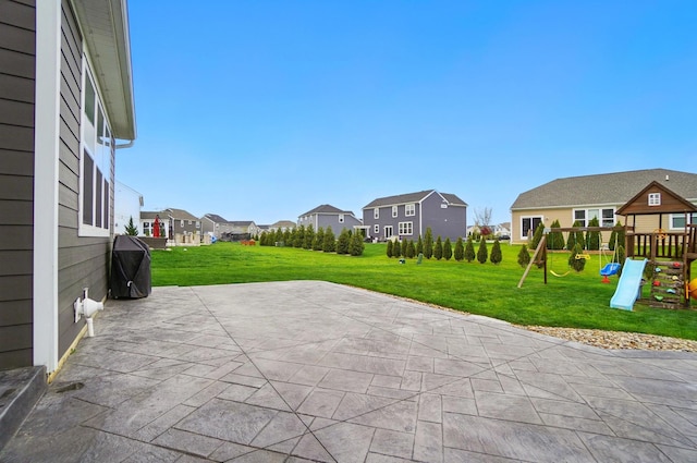 view of patio featuring a residential view and a playground