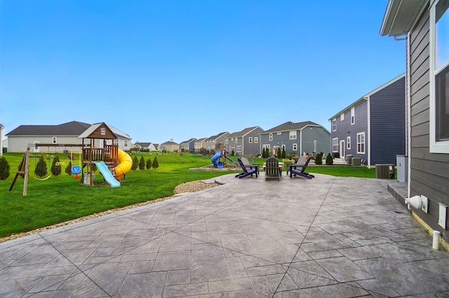 exterior space with a residential view, a playground, and central AC