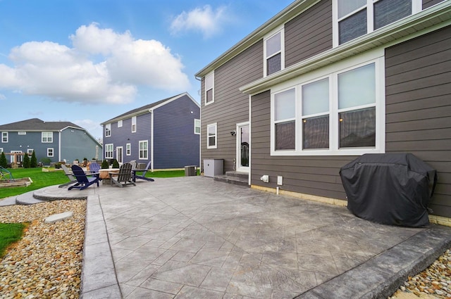 view of patio featuring grilling area, an outdoor fire pit, and a residential view