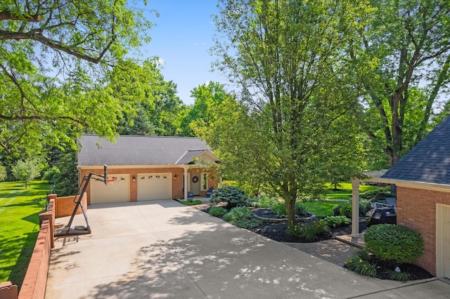 4318 Lyon Dr, Upper Arlington, OH 43220 - view of front facade featuring roof with shingles, an attached garage, brick siding, and driveway