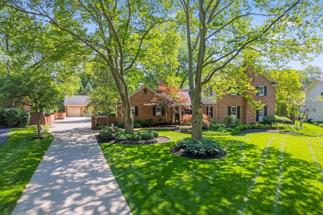 4318 Lyon Dr, Upper Arlington, OH 43220 - view of front of property featuring a front lawn, brick siding, and a garage