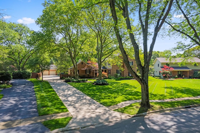 4318 Lyon Dr, Upper Arlington, OH 43220 - view of front of house featuring a front lawn, brick siding, and a garage