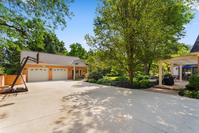 4318 Lyon Dr, Upper Arlington, OH 43220 - view of front facade with an attached garage and driveway