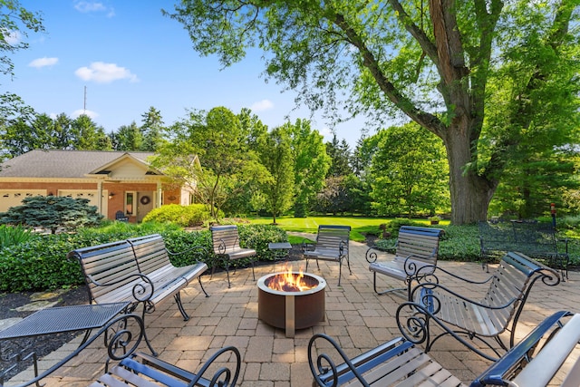 4318 Lyon Dr, Upper Arlington, OH 43220 - view of patio featuring a fire pit and view of scattered trees