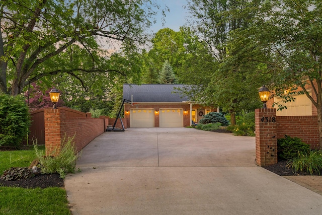 4318 Lyon Dr, Upper Arlington, OH 43220 - view of front facade with driveway and a garage