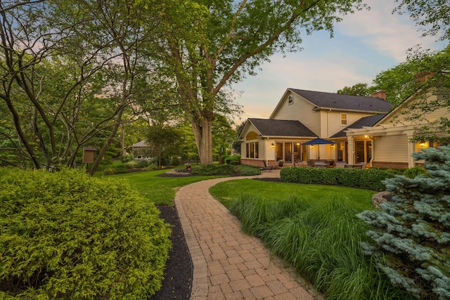 4318 Lyon Dr, Upper Arlington, OH 43220 - yard at dusk featuring a patio area and a yard