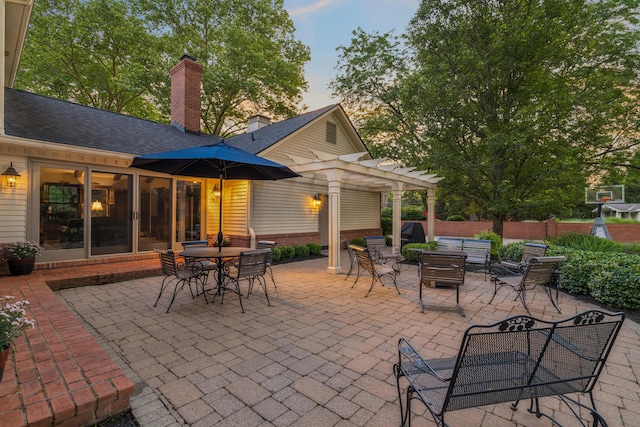 4318 Lyon Dr, Upper Arlington, OH 43220 - patio terrace at dusk featuring a pergola, outdoor dining area, and a patio