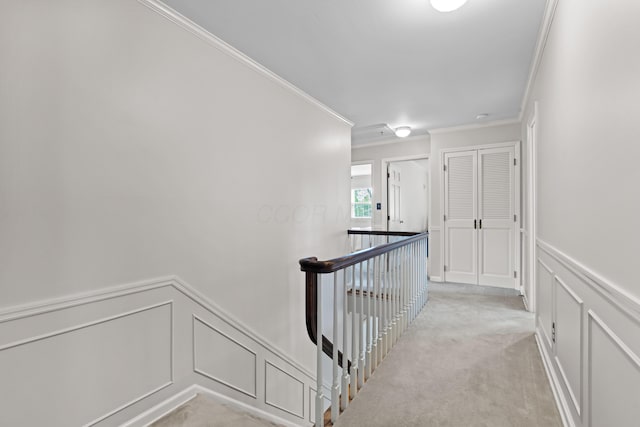 4318 Lyon Dr, Upper Arlington, OH 43220 - hallway with an upstairs landing, ornamental molding, a decorative wall, light colored carpet, and wainscoting