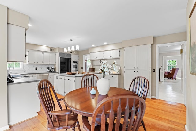 4318 Lyon Dr, Upper Arlington, OH 43220 - dining space with a chandelier, healthy amount of natural light, light wood-style floors, and recessed lighting