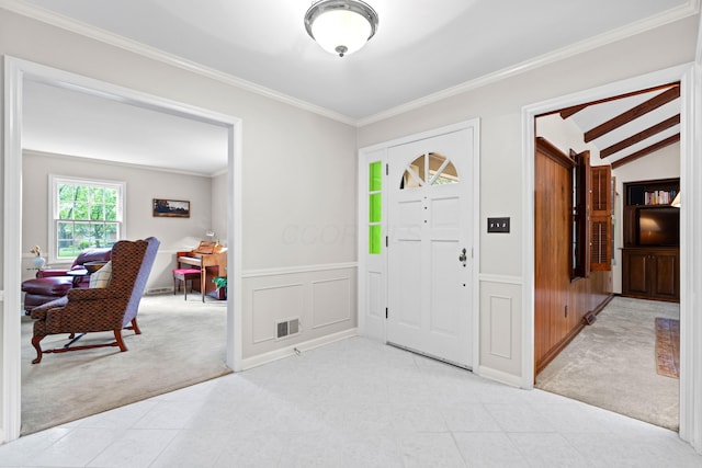 4318 Lyon Dr, Upper Arlington, OH 43220 - entryway with light carpet, a wainscoted wall, ornamental molding, vaulted ceiling, and light tile patterned floors