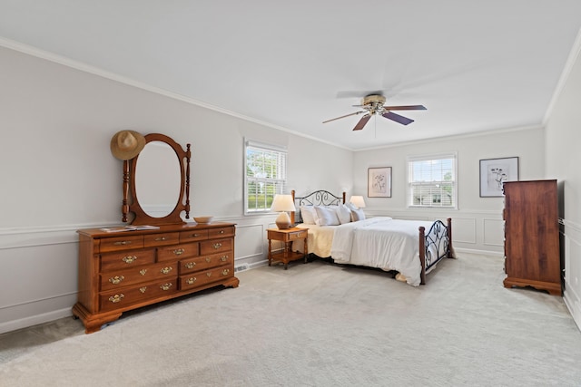 4318 Lyon Dr, Upper Arlington, OH 43220 - bedroom featuring ornamental molding, carpet flooring, multiple windows, a ceiling fan, and wainscoting
