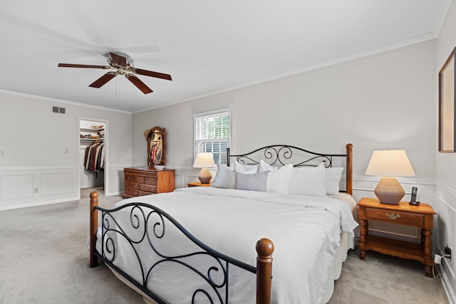 4318 Lyon Dr, Upper Arlington, OH 43220 - bedroom with light carpet, ornamental molding, a spacious closet, a decorative wall, and a closet