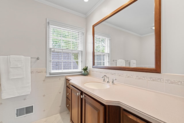 4318 Lyon Dr, Upper Arlington, OH 43220 - bathroom with vanity, tile walls, crown molding, wainscoting, and tile patterned floors