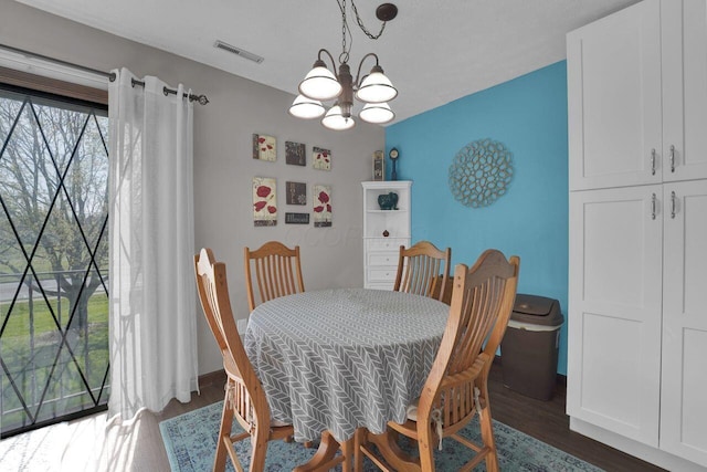 625 Country Club Dr Unit B14, Newark, OH 43055 - dining room featuring dark wood-style flooring, visible vents, and a notable chandelier